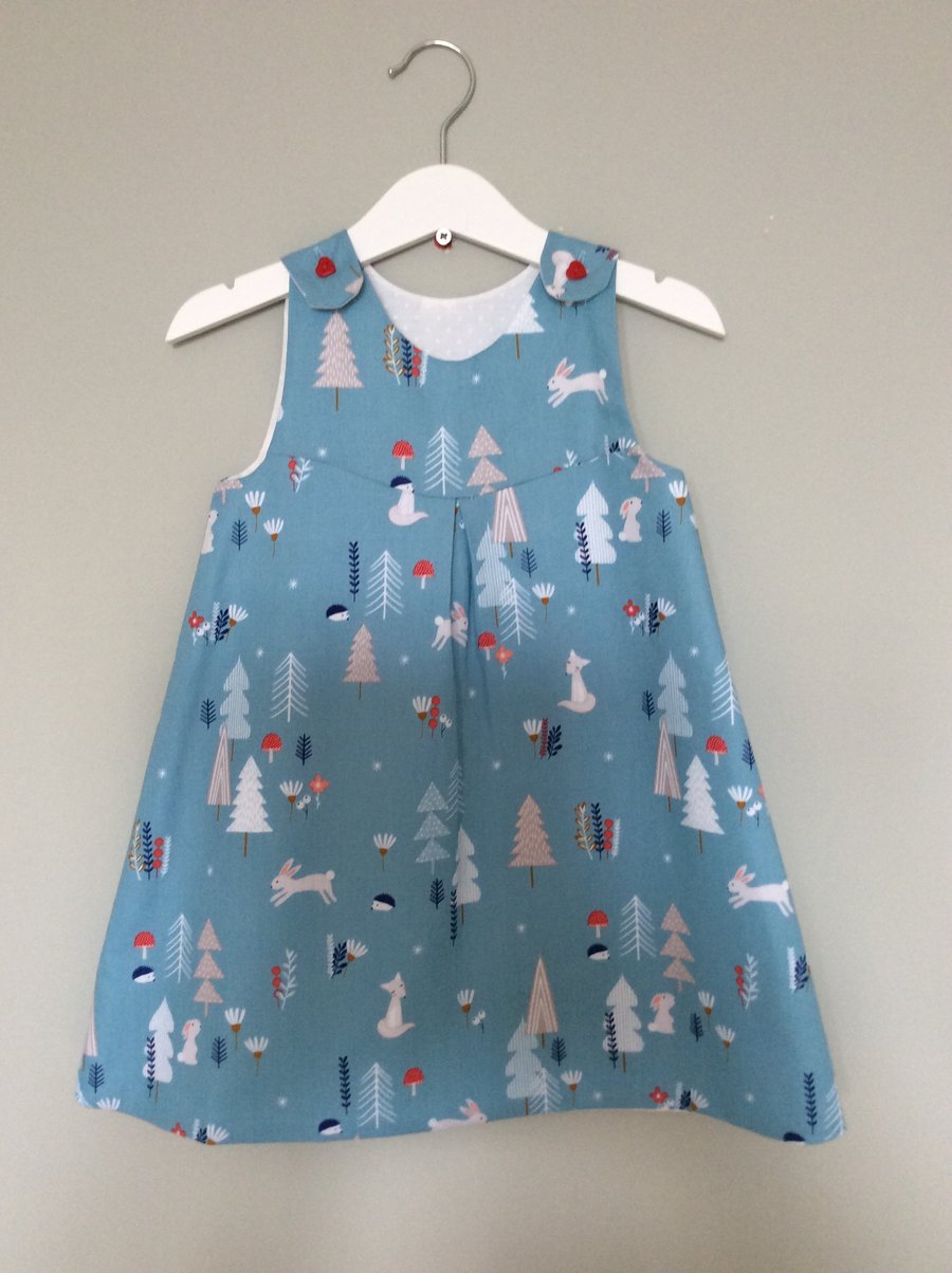 Fully lined and reversible pinafore dress in woodland print age 3