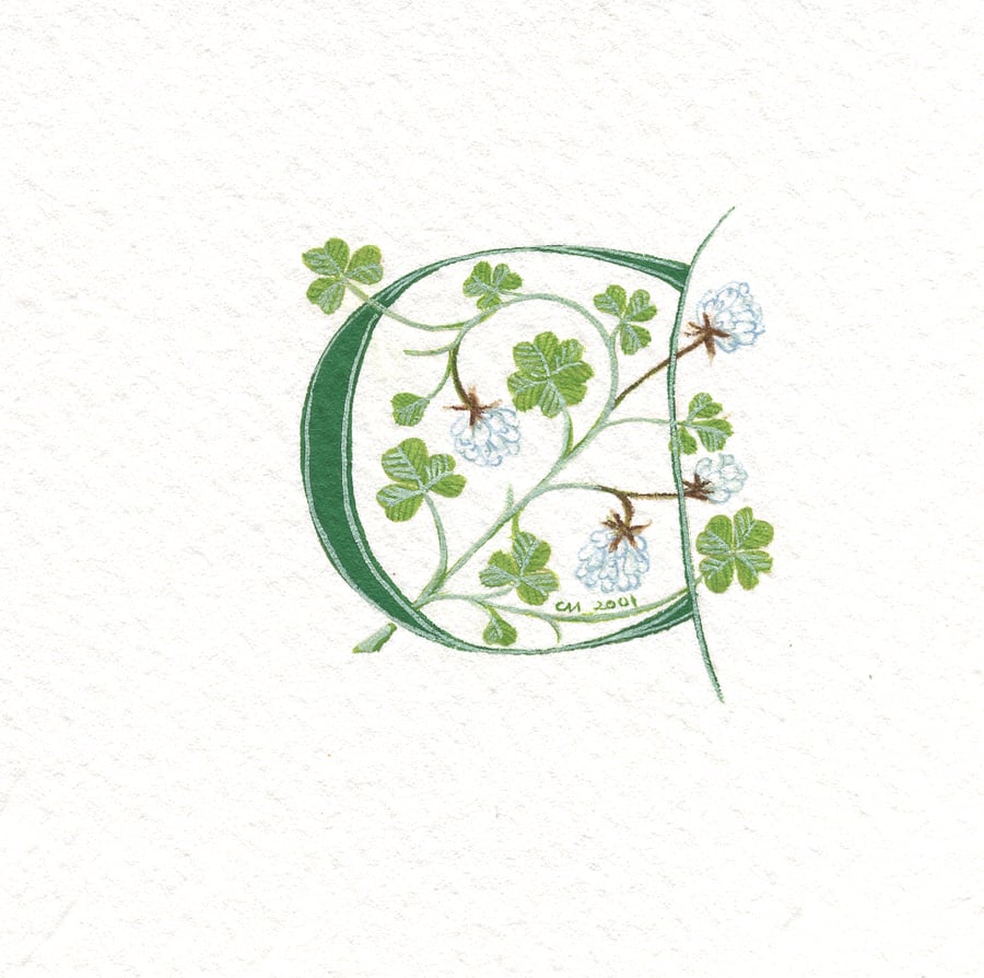 Initial letter 'C' in green with lucky white clover .