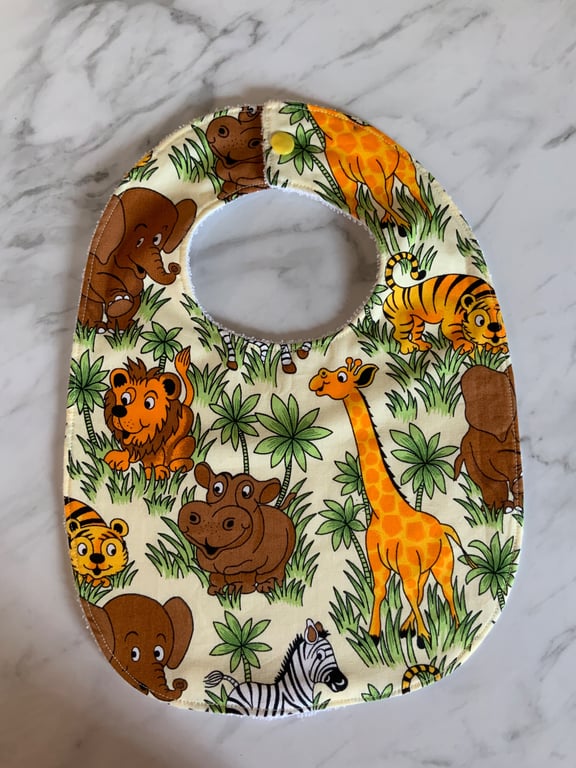 Toddler bib made with animal safari images, elephant, giraffe, tiger.