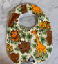 Toddler bib made with animal safari images, elephant, giraffe, tiger.