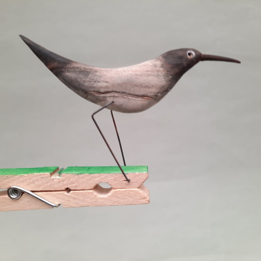 Pecking peg bird