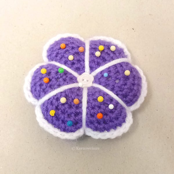 Pin cushion in a purple flower pattern, handmade sewing accessory