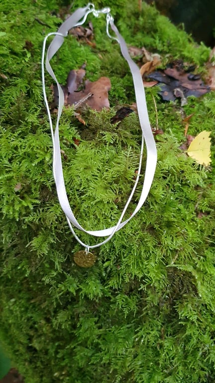 Soft grey layered ribbon with silver chain gold pendant 