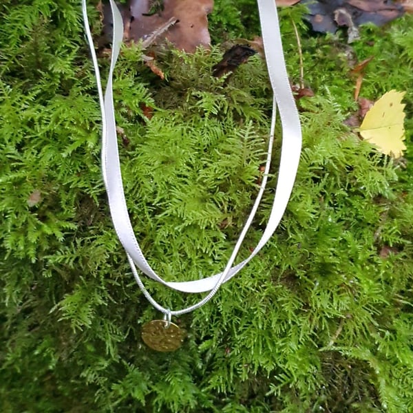 Soft grey layered ribbon with silver chain gold pendant 