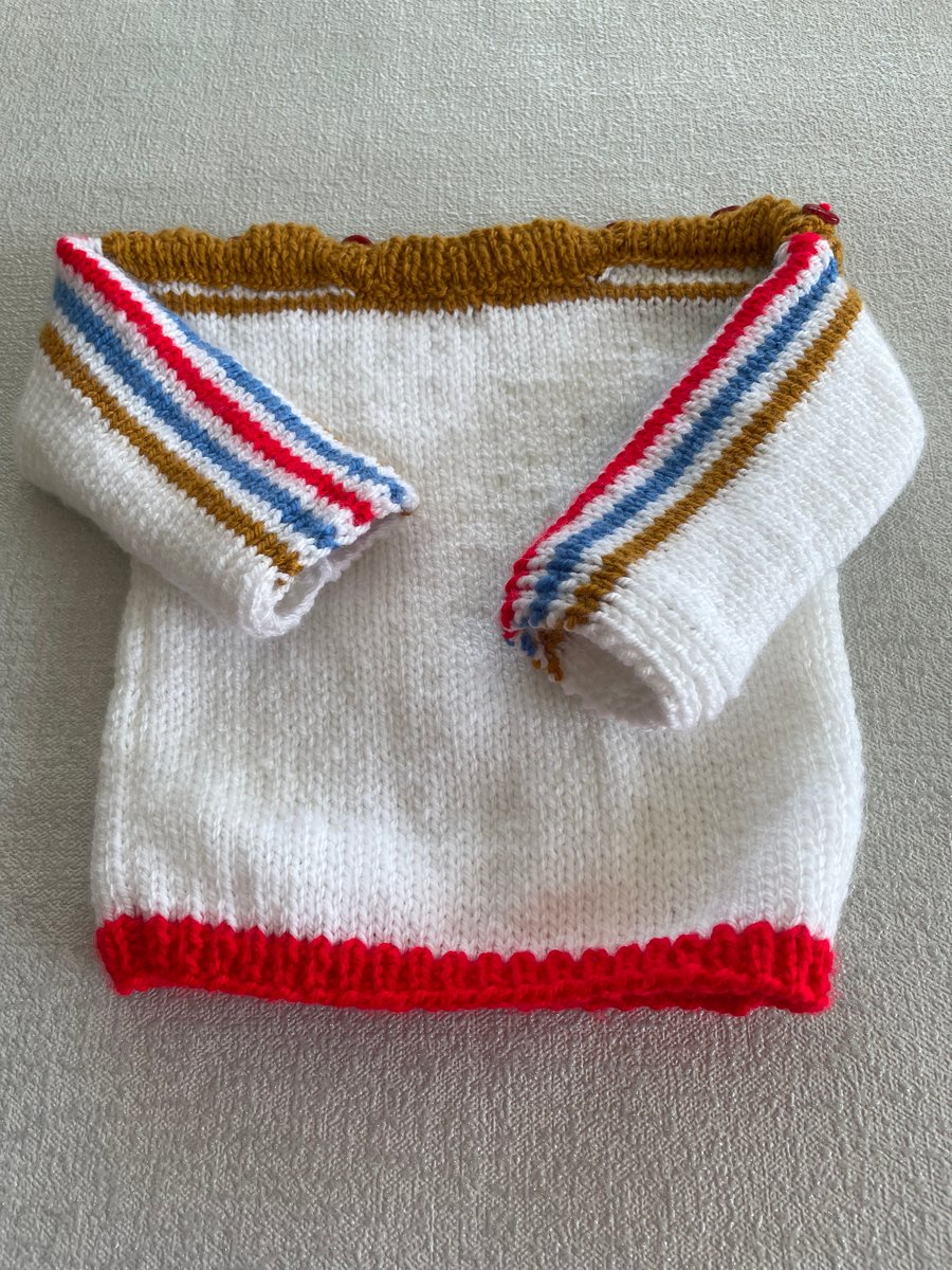 White jumper with coloured stripes 