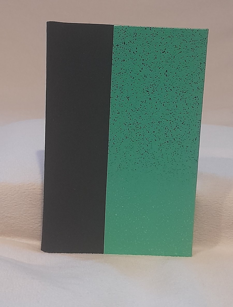 A6 Hand bound note book, black and sparkling green. 