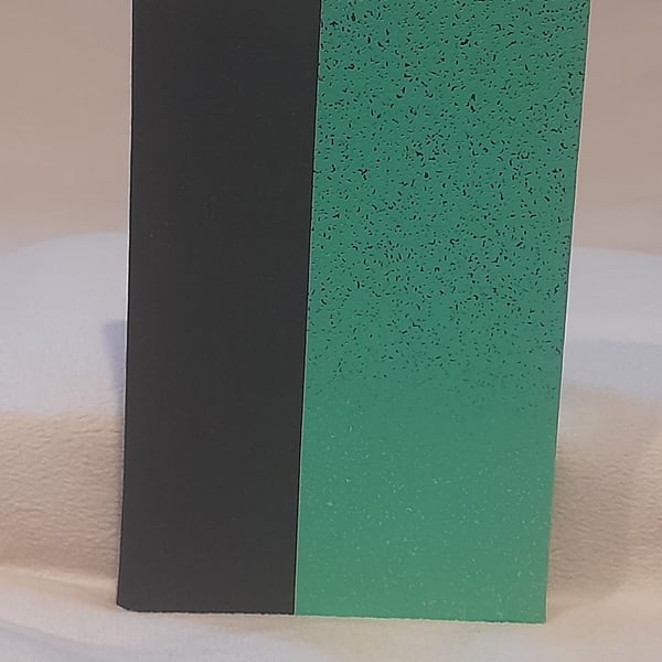 A6 Hand bound note book, black and sparkling green. 