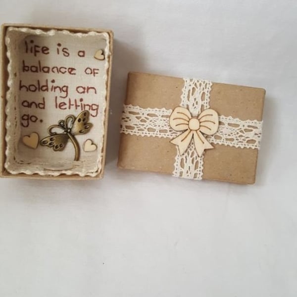 small miniature art diorama with a message 'life is a balance...................