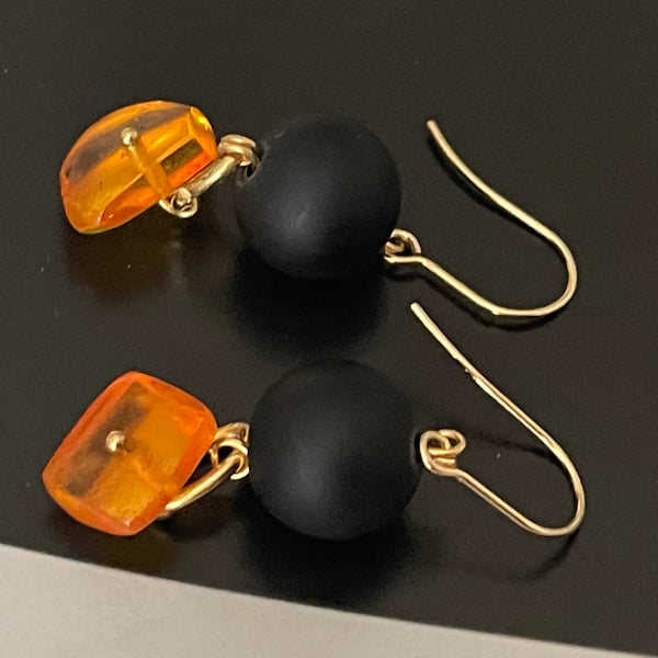 Artisan handmade Baltic honey colour amber and black glass dangling earrings