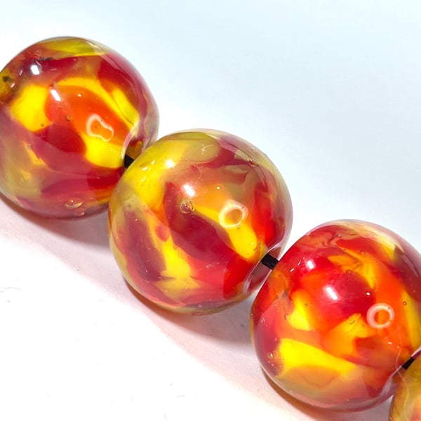 Handmade fire patterned lamp work glass beads