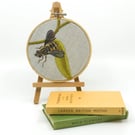 Embroidered hoop picture of a tiger hoverfly