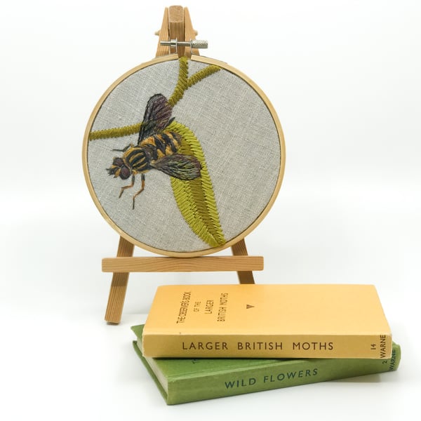 Embroidered hoop picture of a tiger hoverfly