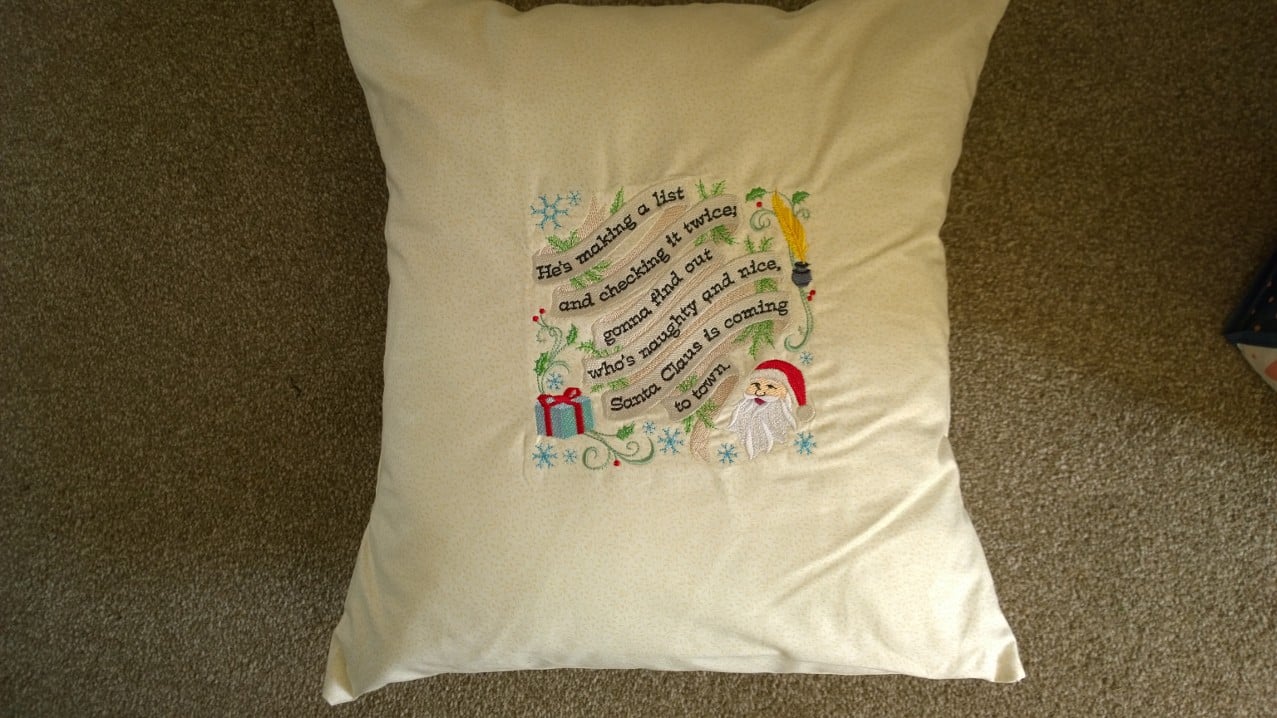 He's making a list and checking it twice cushion cover