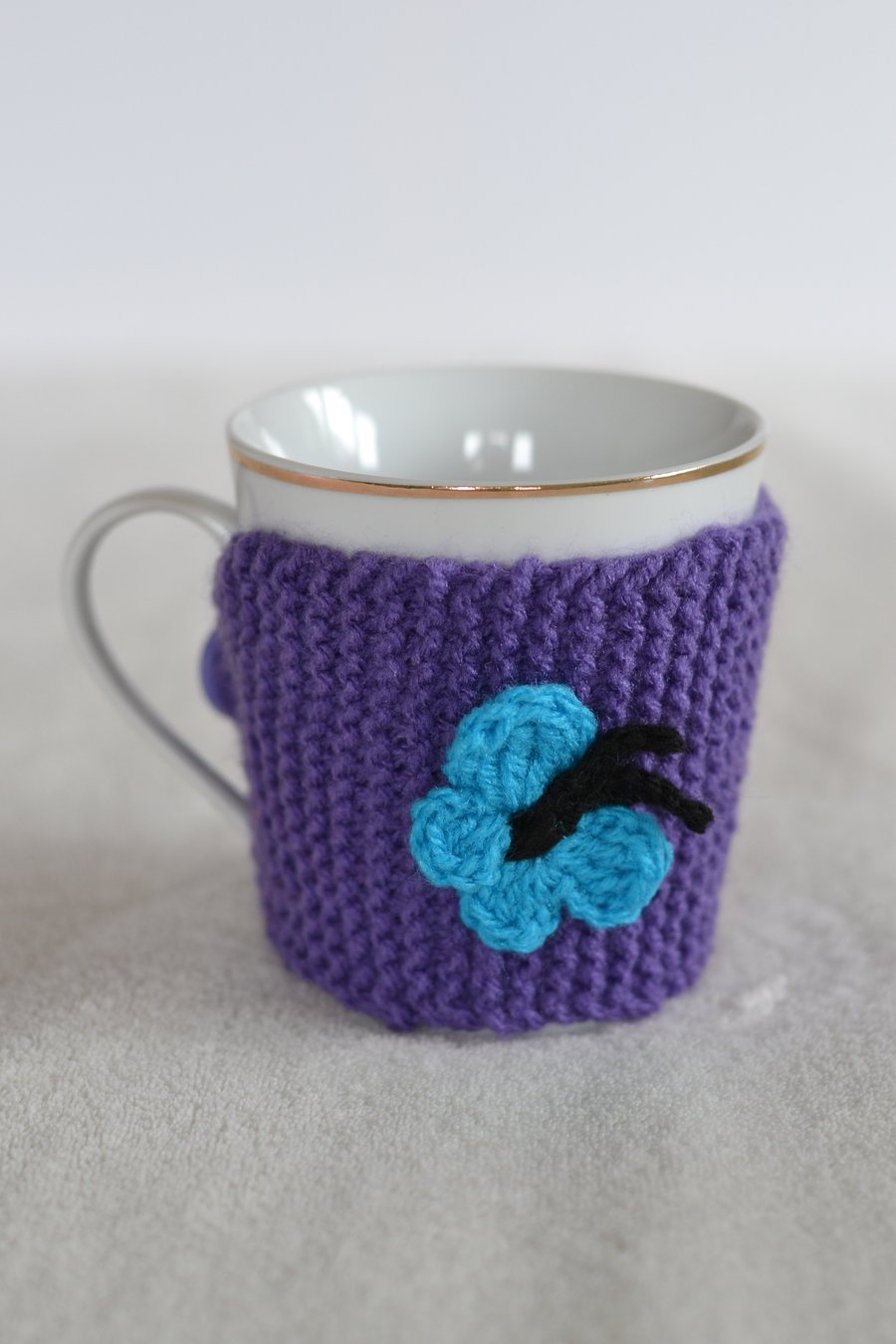 Purple knitted Cup Cozy With Butterfly