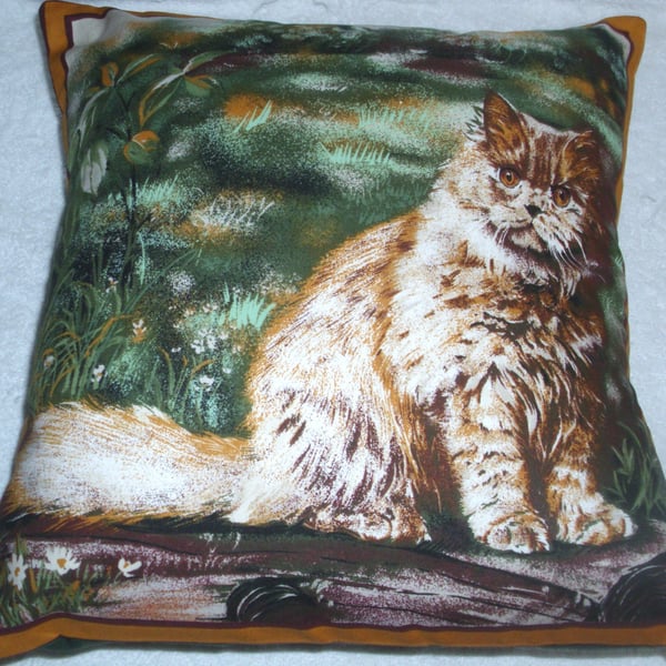 Lovely fluffy cream cat in the garden cushion