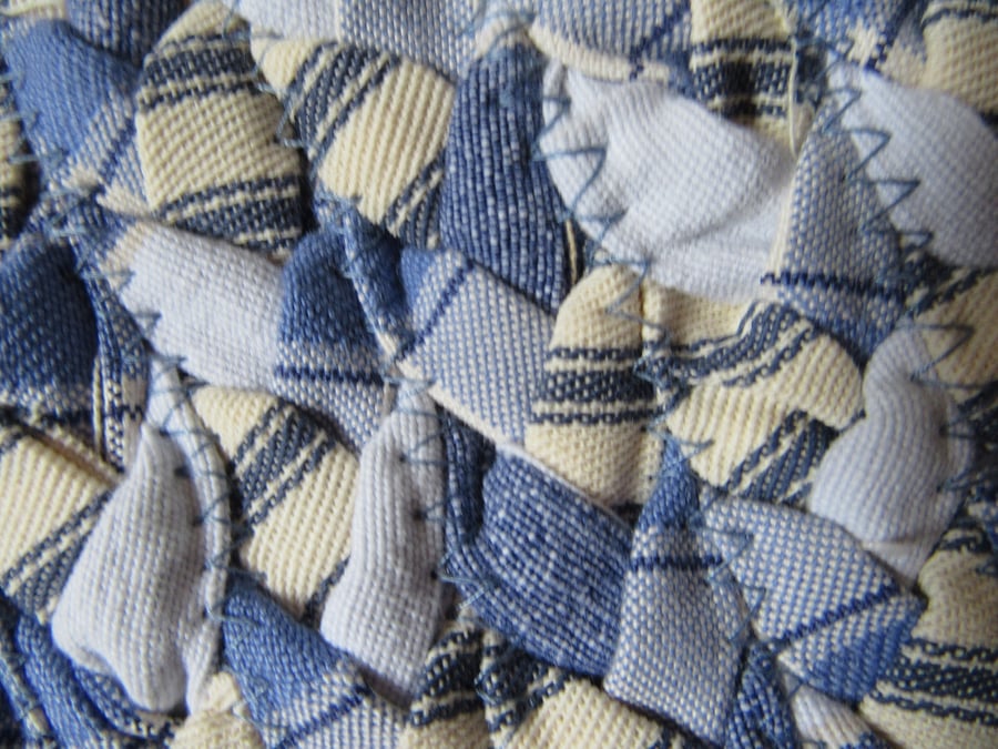 Handmade blue braided oval rug