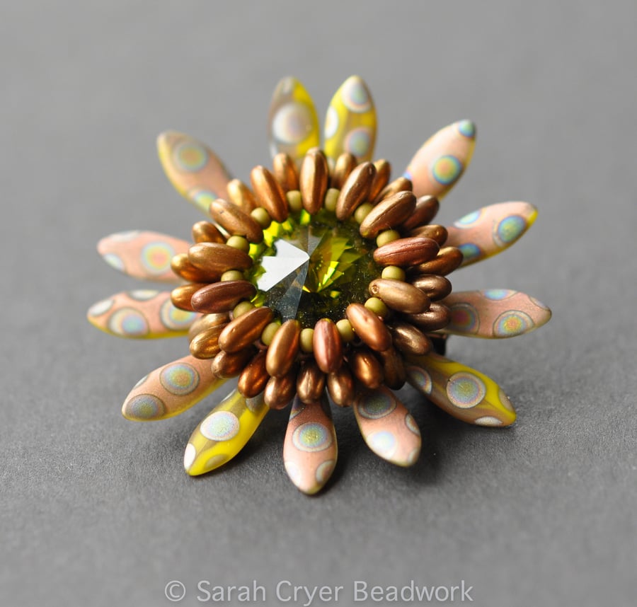 Beadwoven olive and copper peacock dagger brooch.