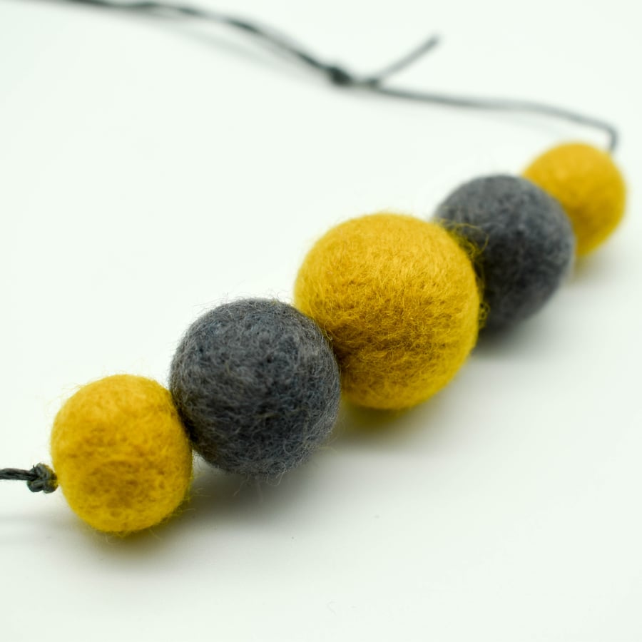 Felted bead necklace in grey and yellow wool