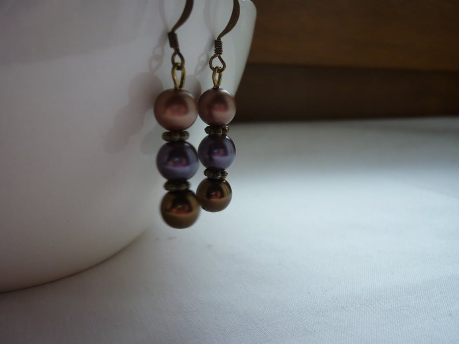 EGGPLANT, COFFEE AND BRONZE EARRINGS.  291