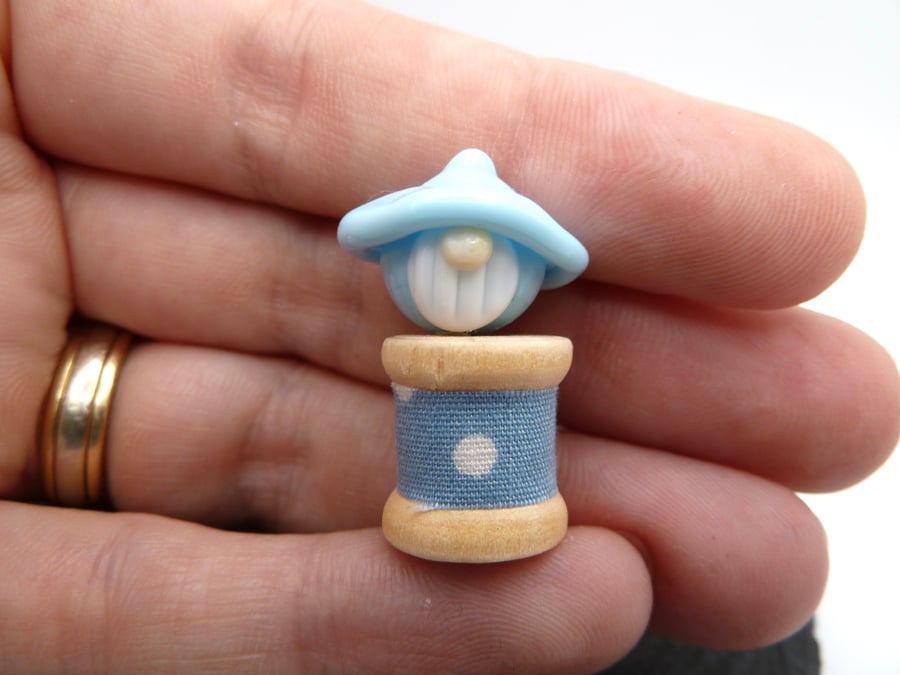 small glass bobbin, blue gnome