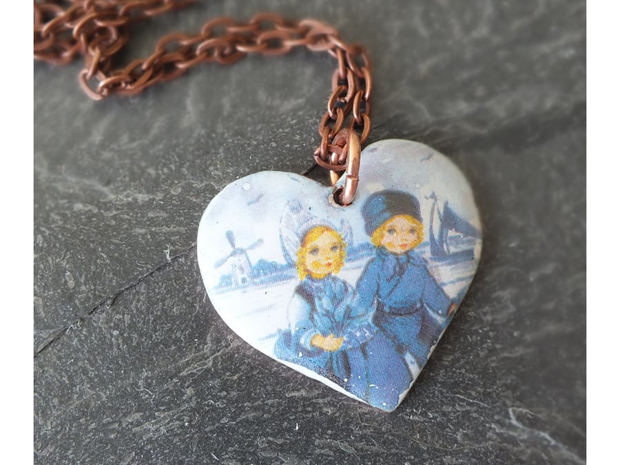 Dutch boy and girl heart pendant