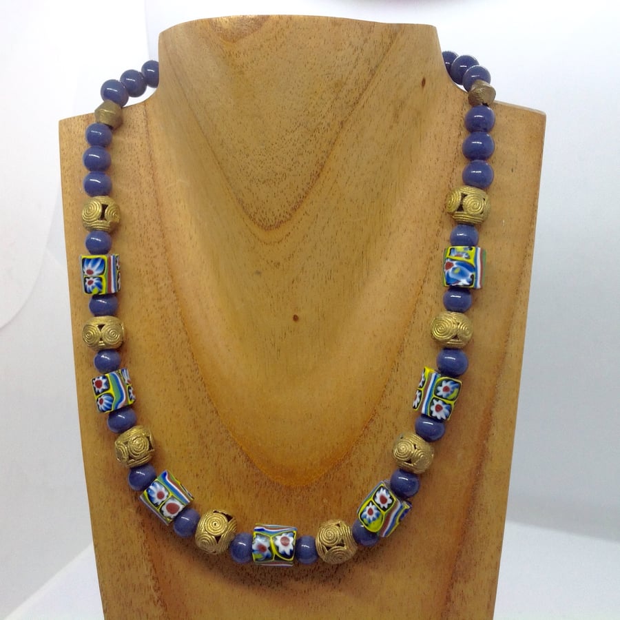 A millefiori glass bead necklace with African beads of recycled brass