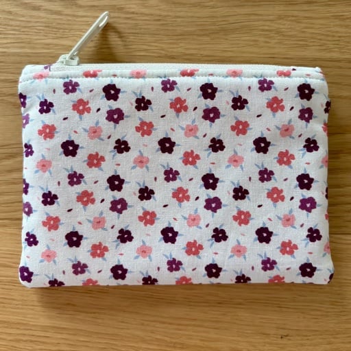Small zipped fabric purse, pouch, make up bag, in cream and pink floral print.