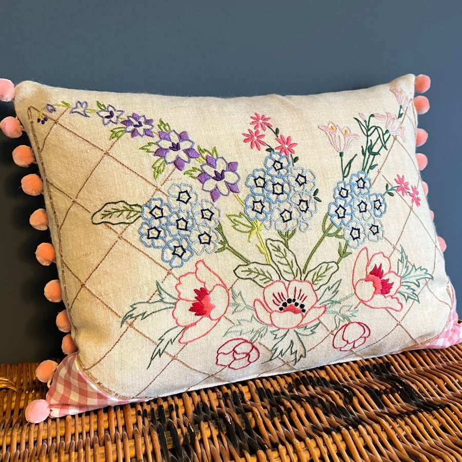 Repurposed embroidery cushion cover with pink gingham and pompoms