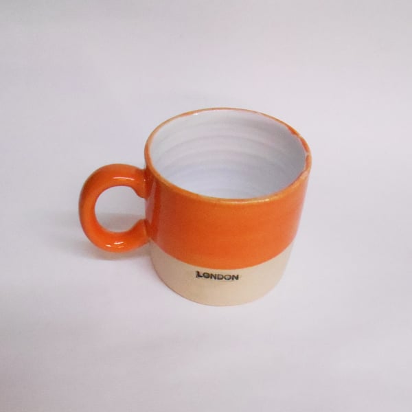 Mug, Bright Orange glazed Ceramic new London logo.