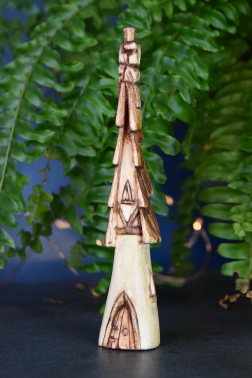Hand carved wooden fairy house