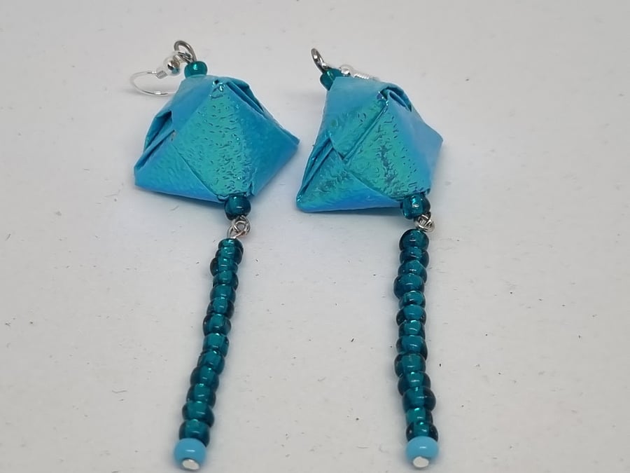 Long origami earrings:  light blue iridescent paper and small beads 