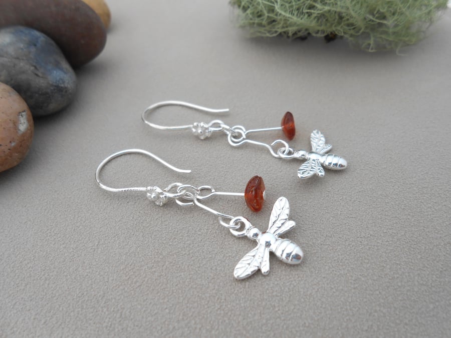 Sterling silver bee and baltic amber drop earrings.