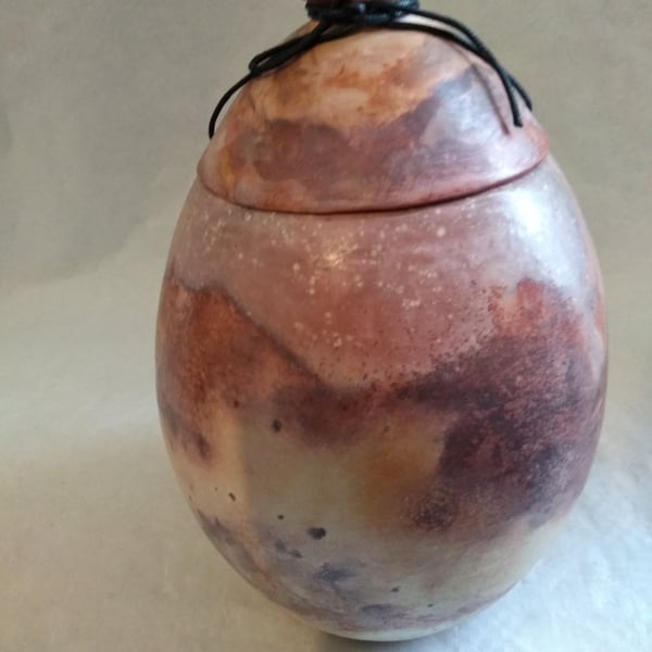  CERAMIC URN WITH TIE ON LID  26cms x 20 cms 