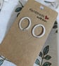 Oval Frame Hammered Sterling Silver Stud Earrings - Image 1