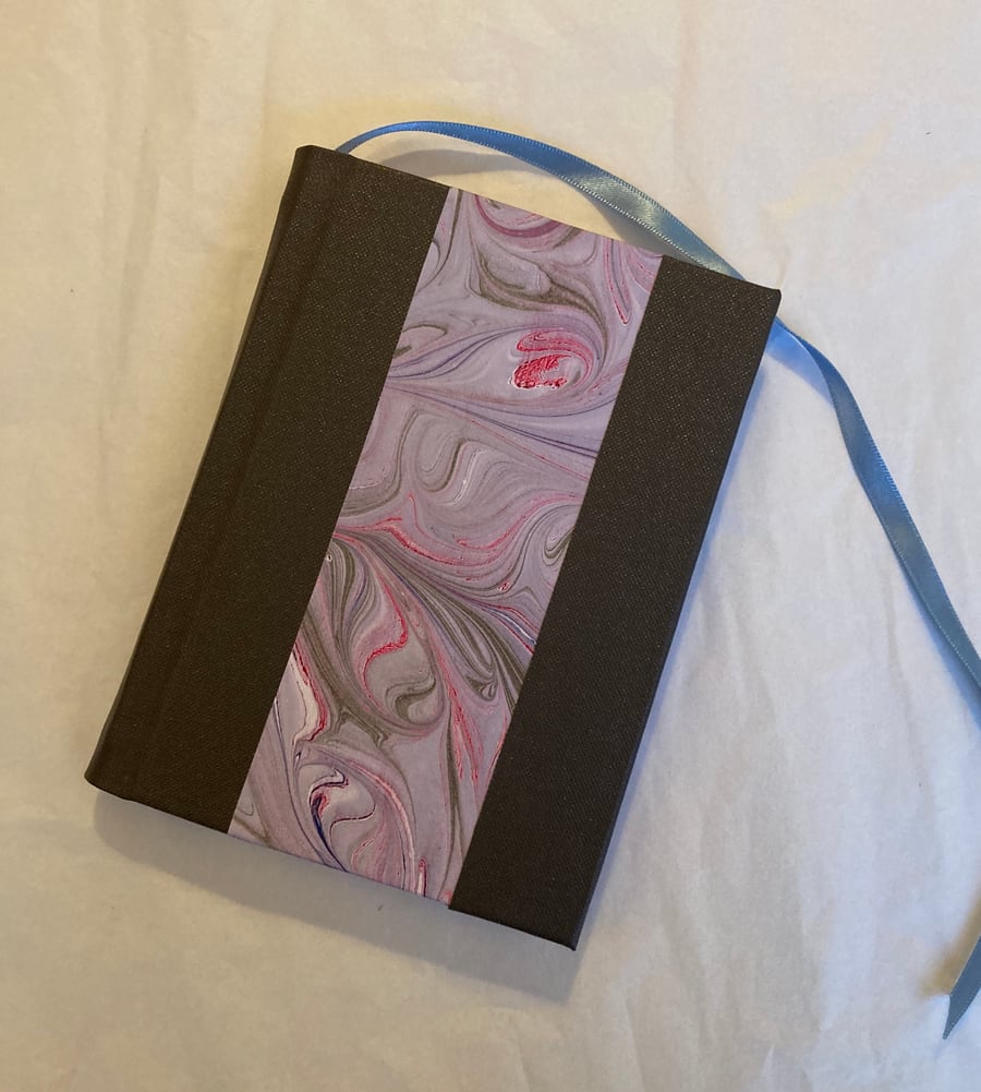 Small violet-marbled book with grey spine