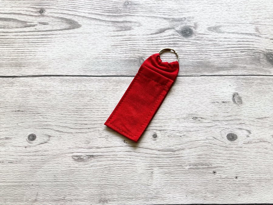 Red cotton fabric lip balm holder keyring. Lipstick keychain.