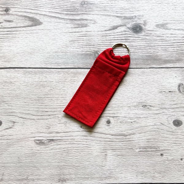 Red cotton fabric lip balm holder keyring. Lipstick keychain.