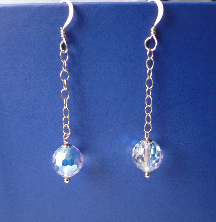 Sparkling Chrystal globe drop earrings on a gold chain