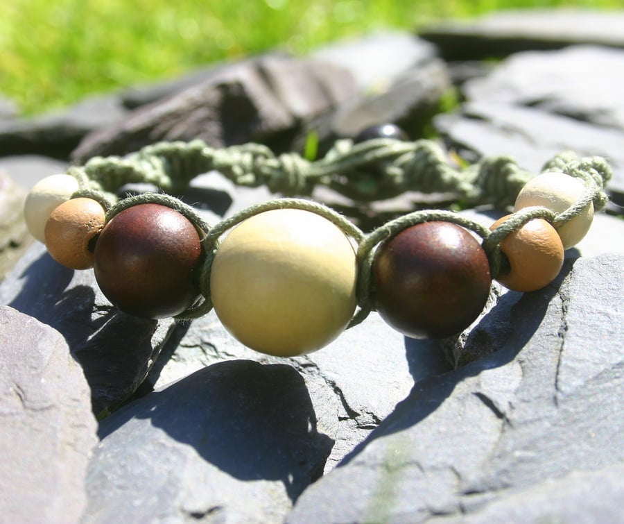 Brown and green boho chic braided friendship bracelet with wood beads