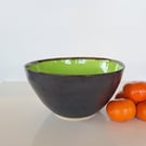 A HAND THROWN LARGE SALAD BOWL - glazed in green and charcoal