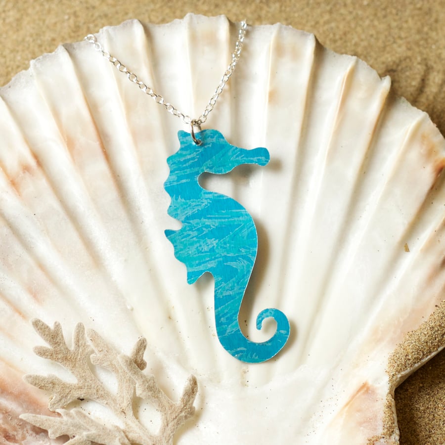 Delicate Seahorse necklace in anodised aluminium on a silver chain.