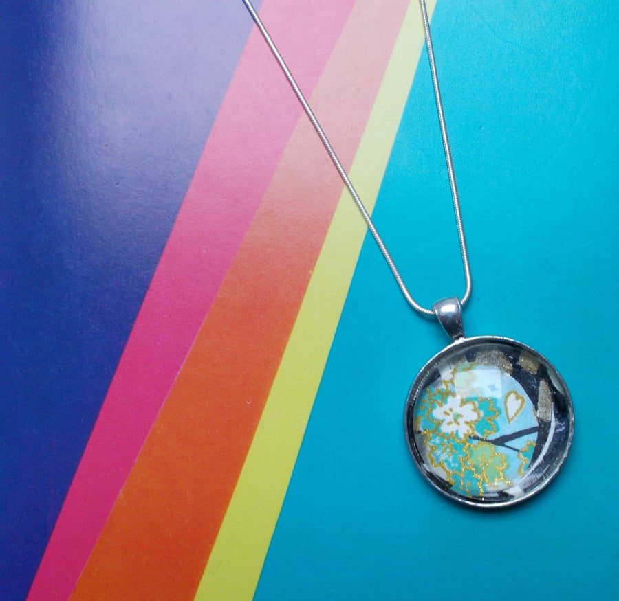 A Small Fragment of an Original Collage in a Pendant