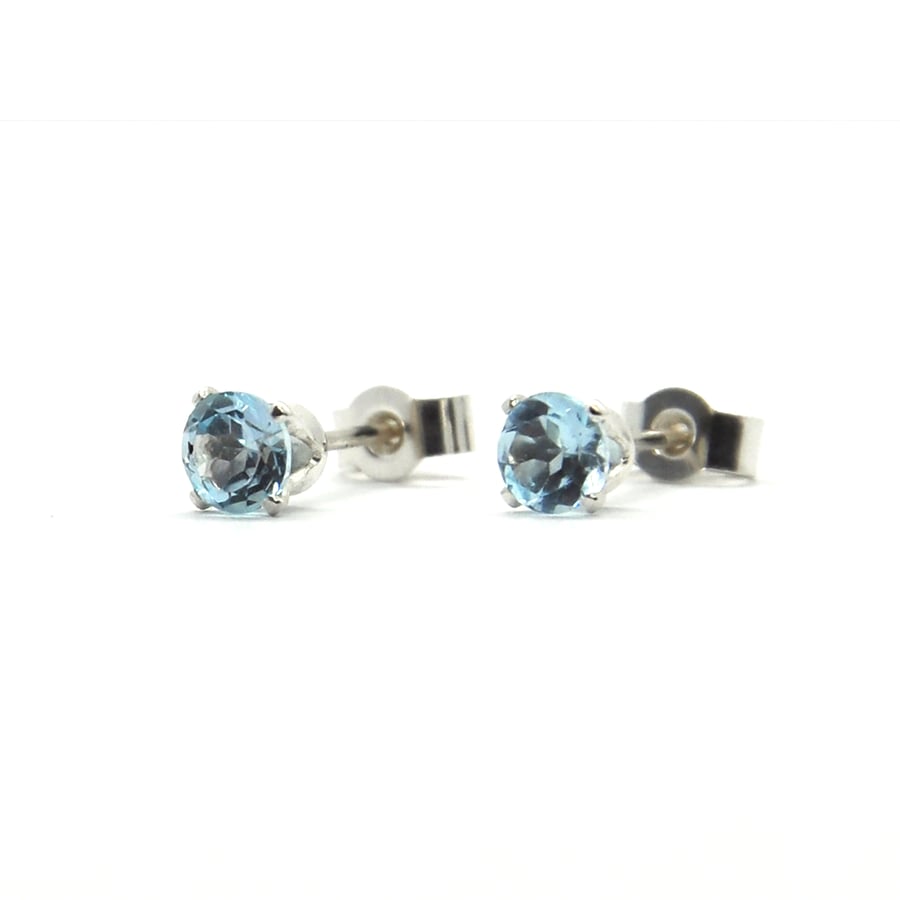 Silver sky blue topaz stud earrings - claw set