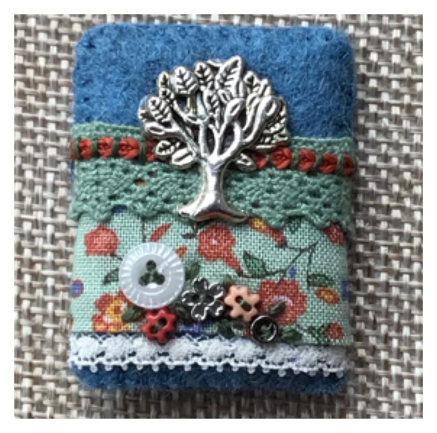 Brooch. Liberty fabric, felt, lace and tree charm.