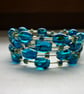 TEAL AND GOLD MEMORY WIRE BRACELET.  1006 - Image 1