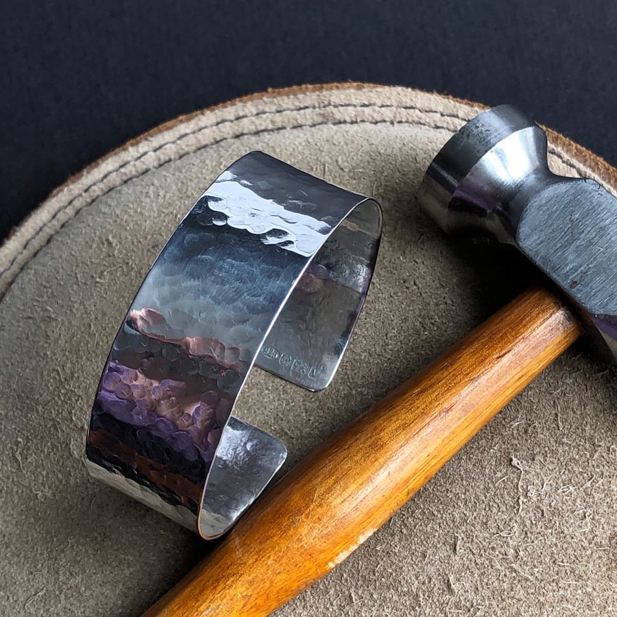 Sterling silver bangle with hammered detail.