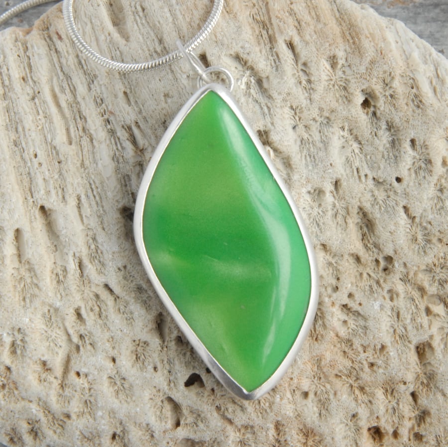 Shimmering green bowlerite and sterling silver free form pendant