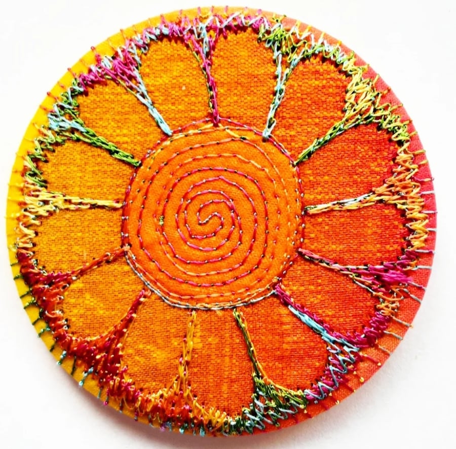 58mm Fabric Badge with Free Machine Embroidery Orange and Orange Flower 