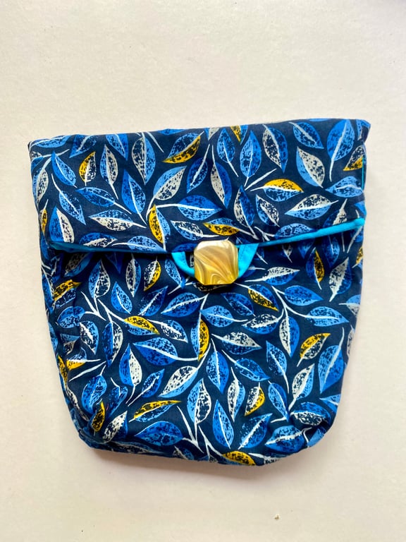 A fully lined button and loop fastening tidy all  bag