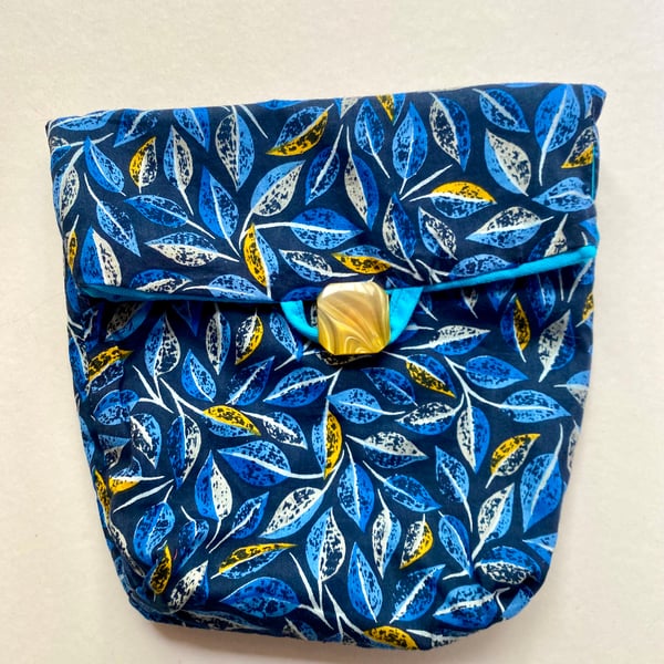 A fully lined button and loop fastening tidy all  bag